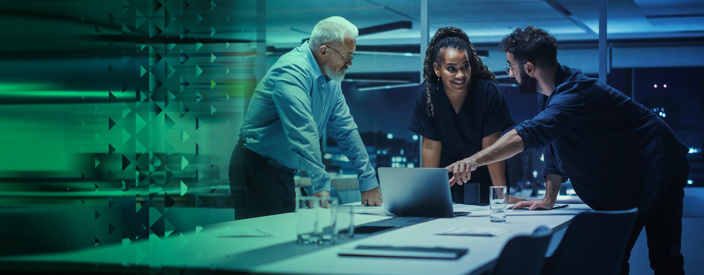 Three people around a table working
