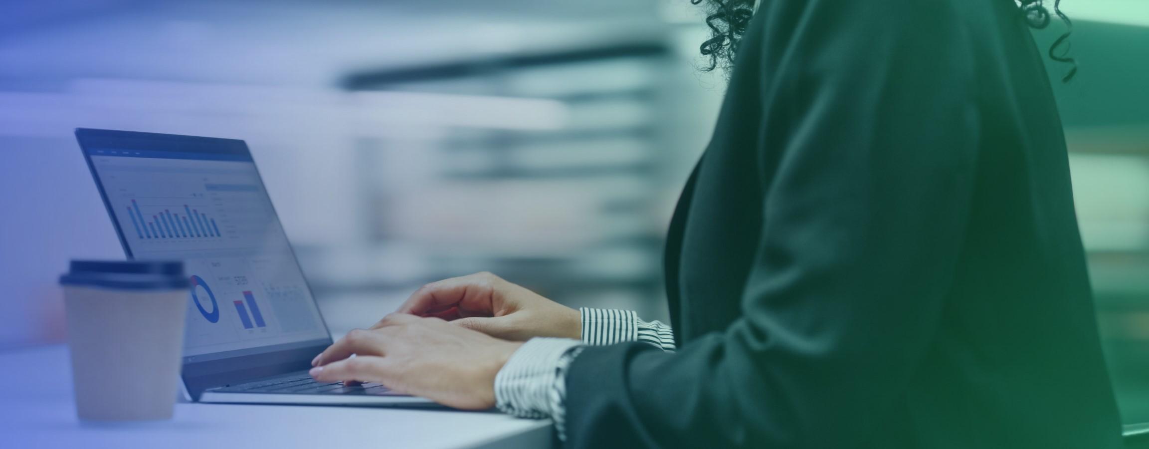 Stock image of an employee working on their laptop