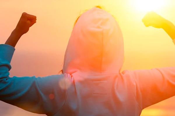 Person bending his arm in victory and symbolizing progress