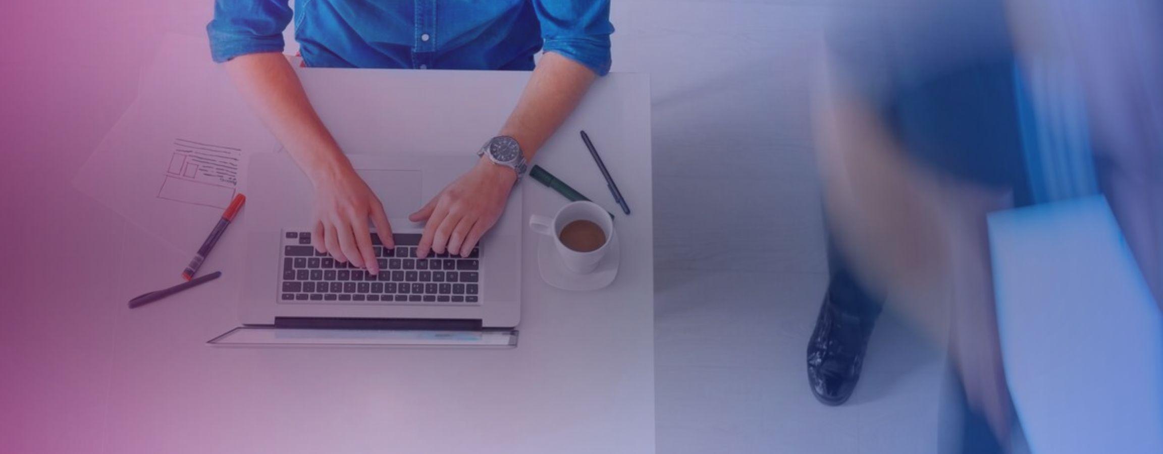 A birds eye view of an employee working at their computer
