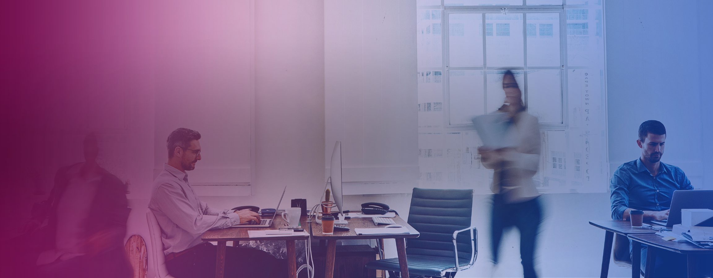 A stock image of people working in an office