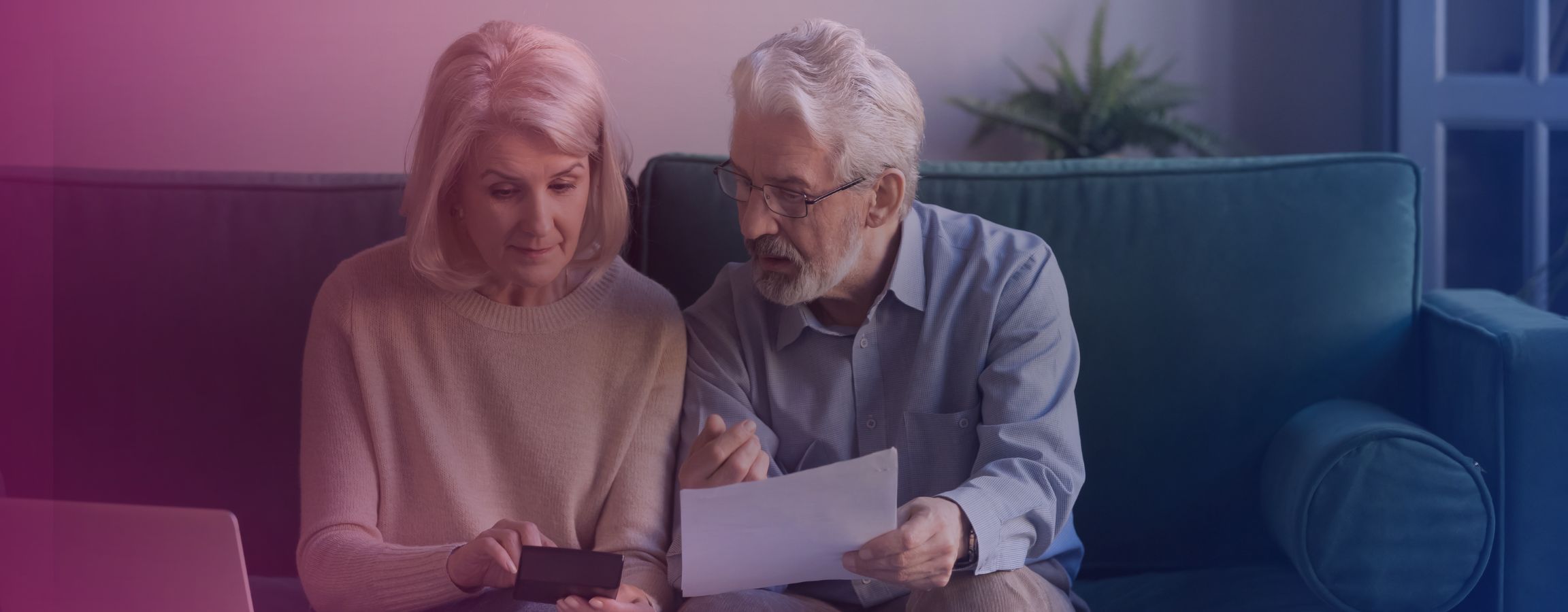 stock image of older couple working out finances