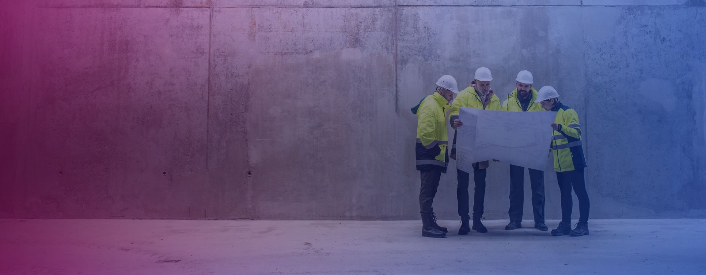construction workers looking at some work