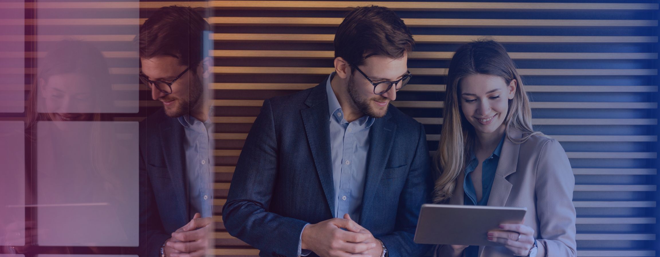 Employees looking at work together