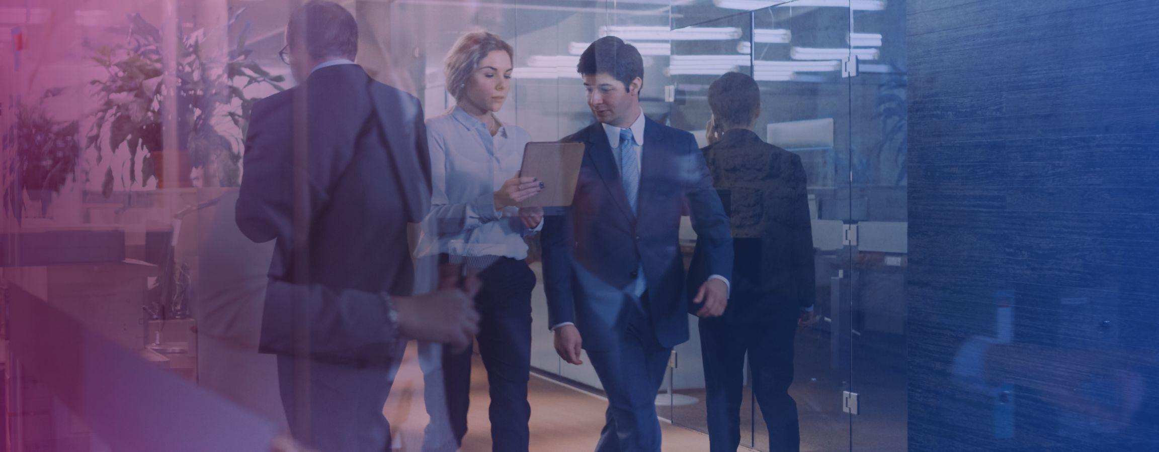 corporate colleagues walking through a hallway