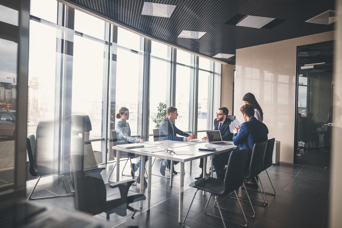 Group of people around a table having a meeting
