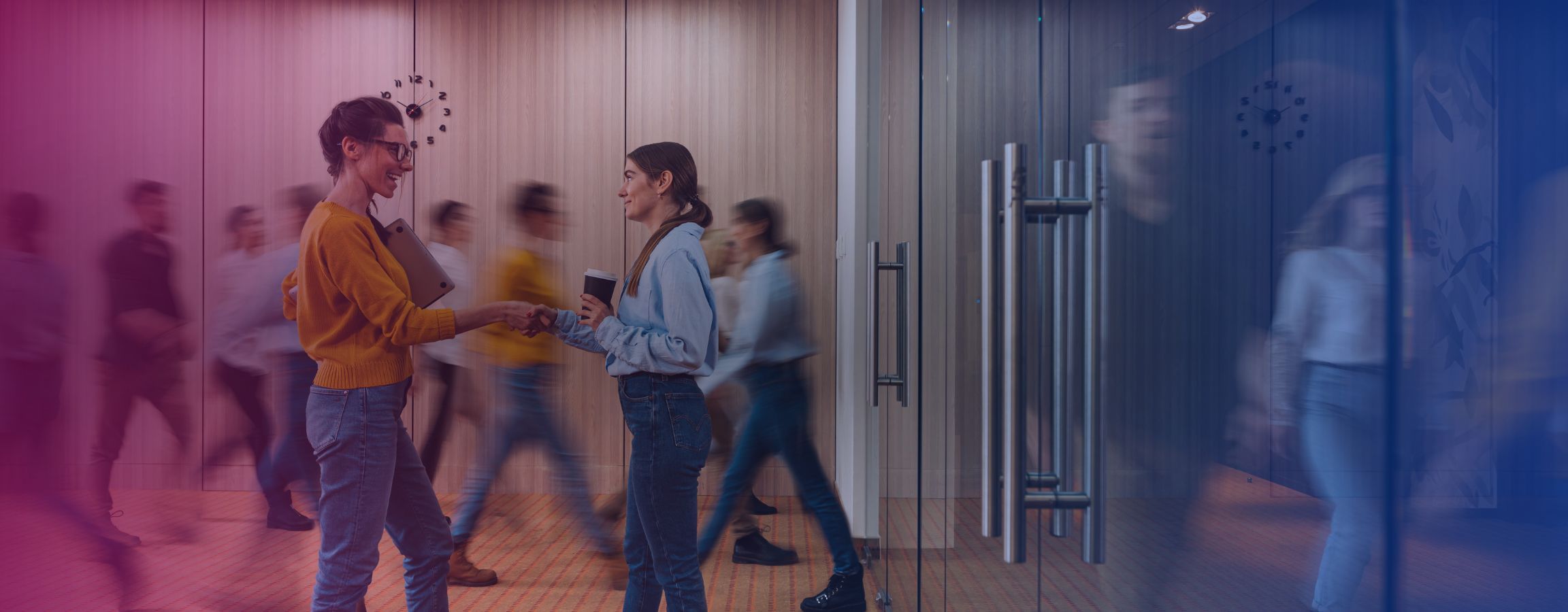 Office stock image with two employees shaking hands