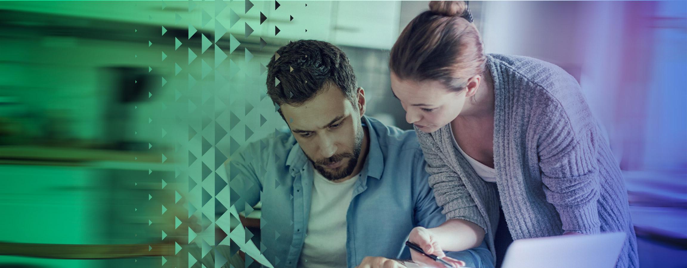 Man and woman working on a laptop