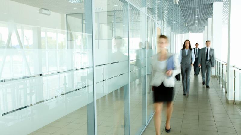 People walking down a corridor