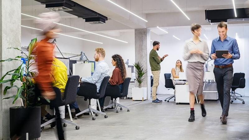 People walking in a busy office