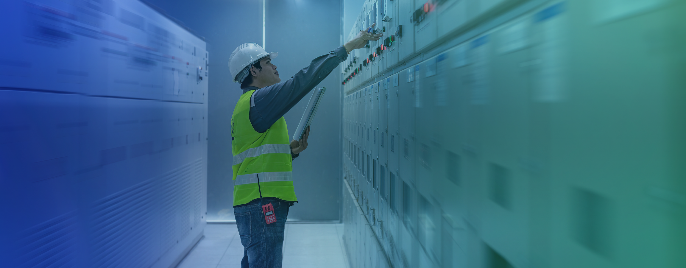 A stock image of a worker in lab wearing a high-vis uniform and hat