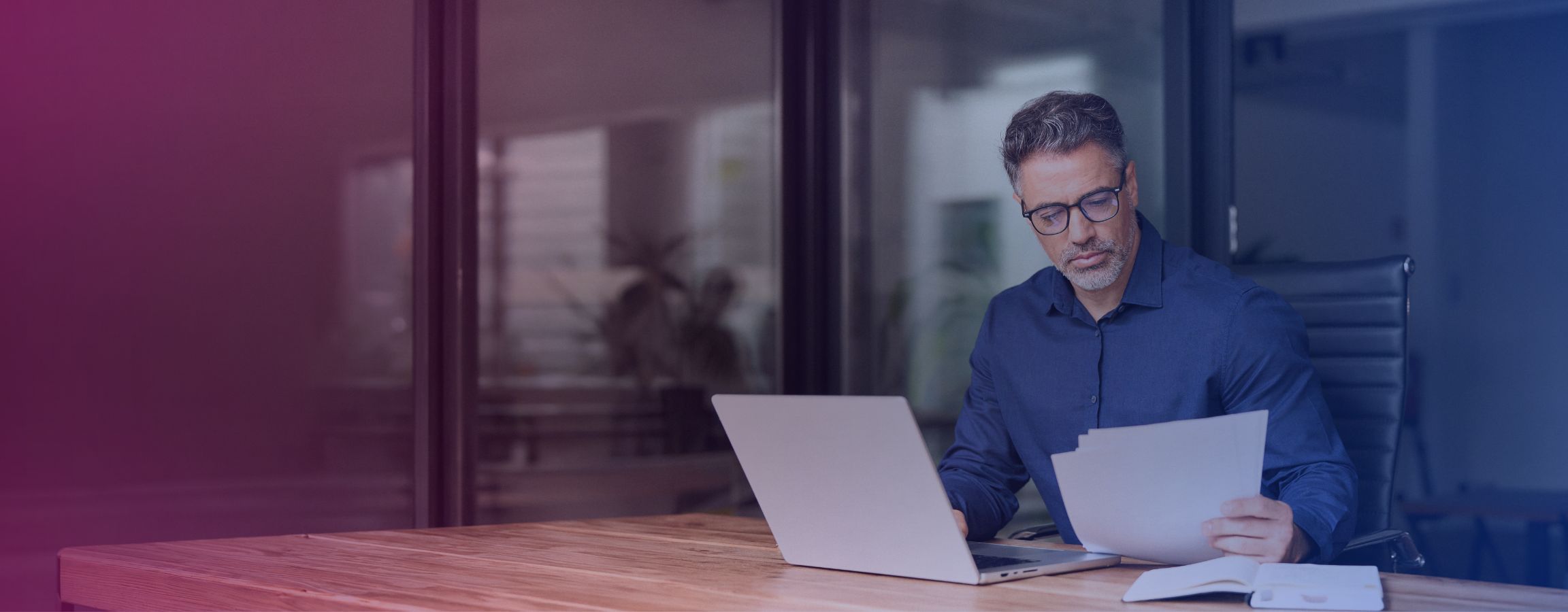 Older man working on a laptop