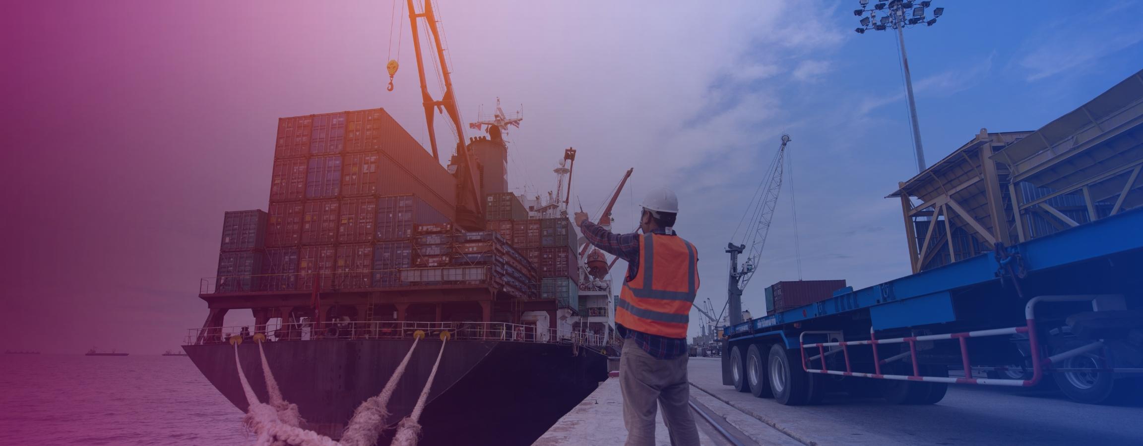 worker next to cargo ship