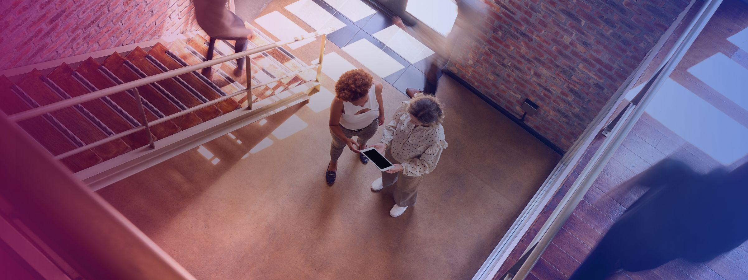 women_looking_at_tablet