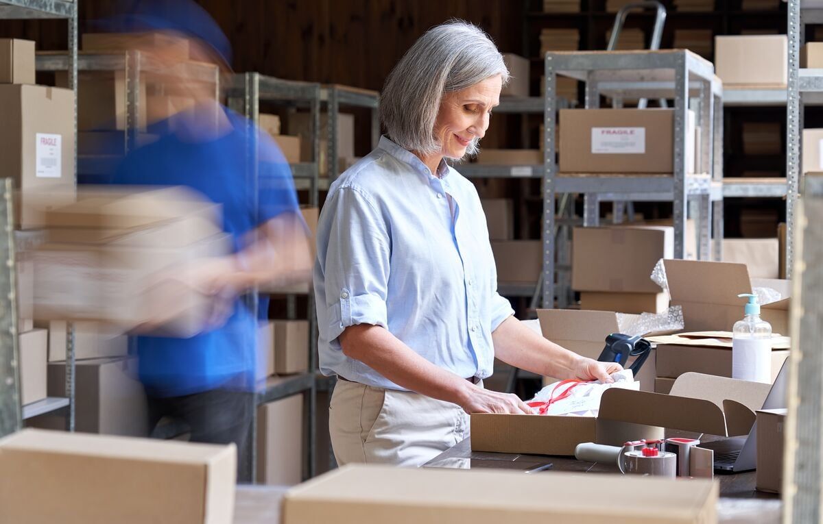 Woman packing shipments in a warehouse