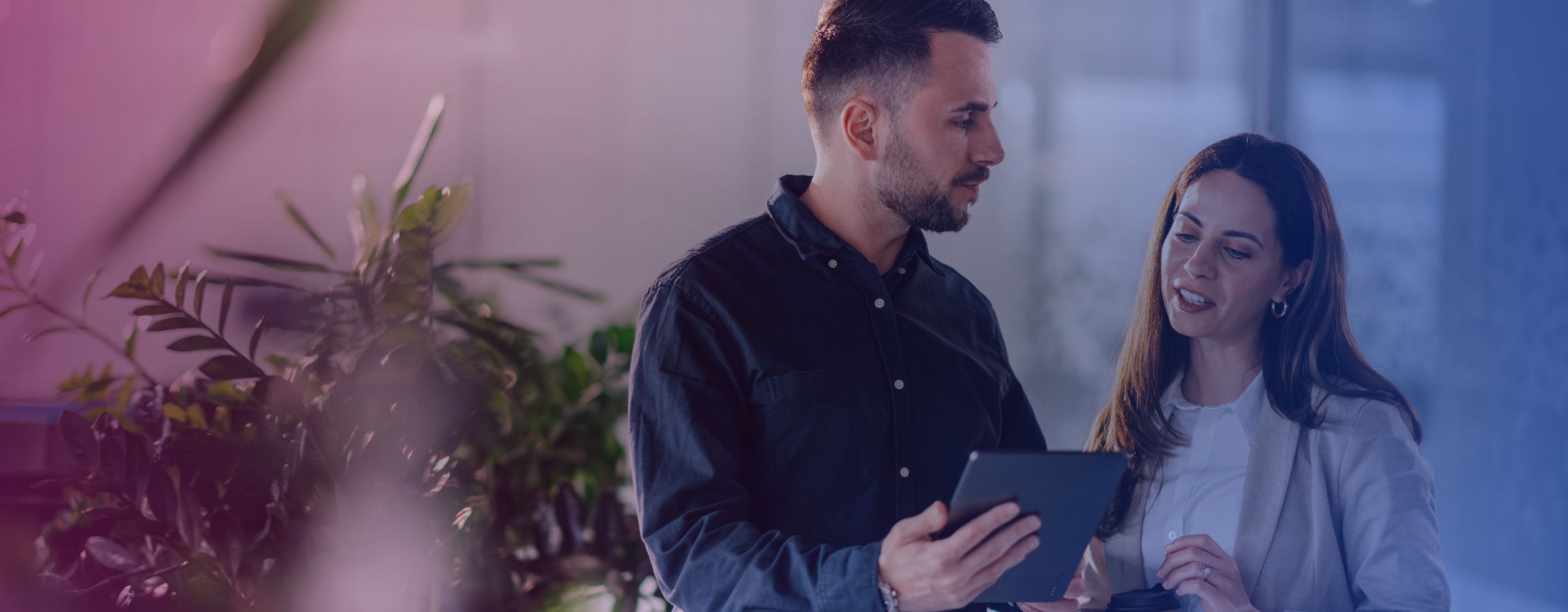 Colleagues looking at a tablet together