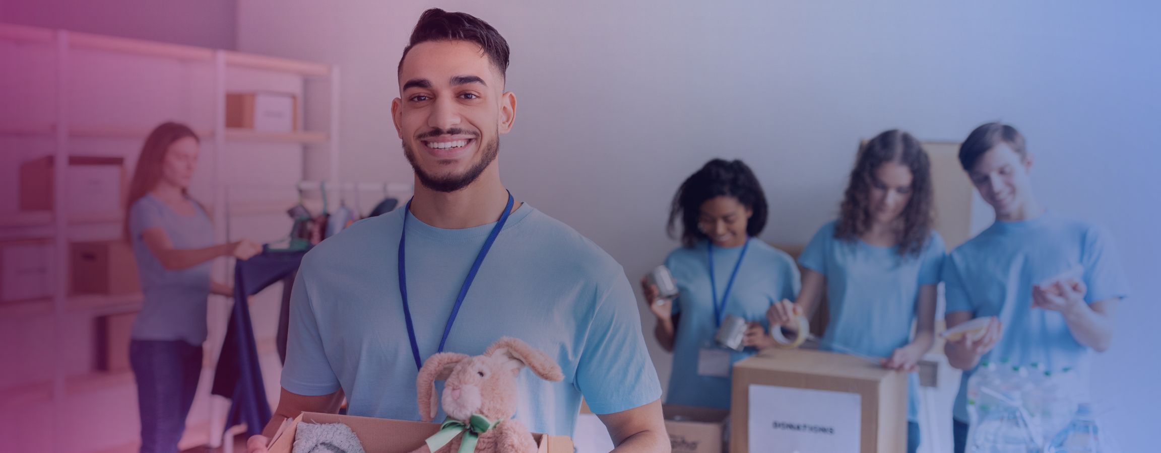 Stock image of volunteers sorting through donations for a charity