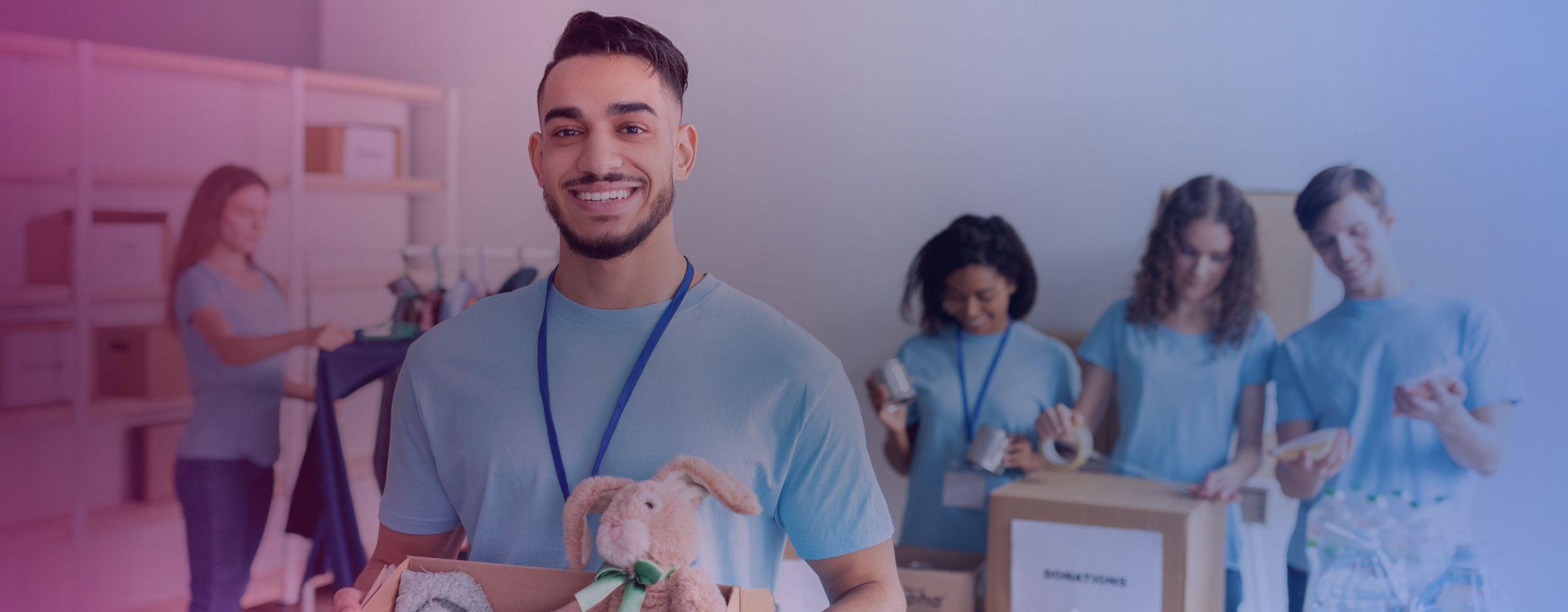 Stock image of volunteers sorting through donations for a charity