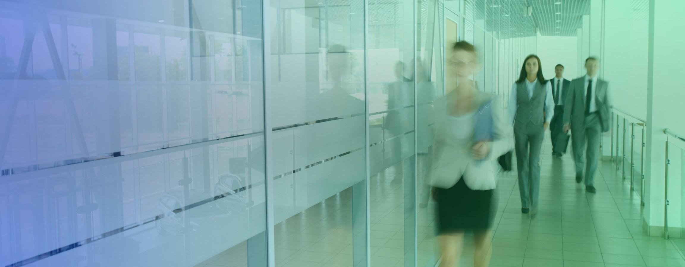 Employees walking down a corridor