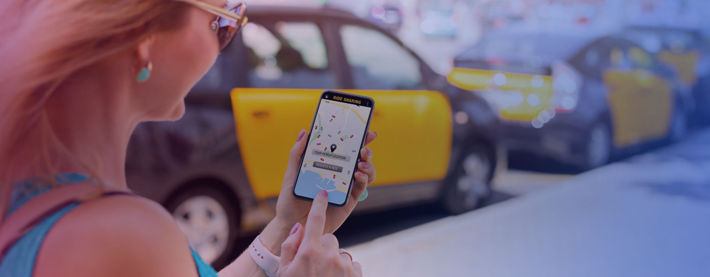 A person booking a taxi on their phone