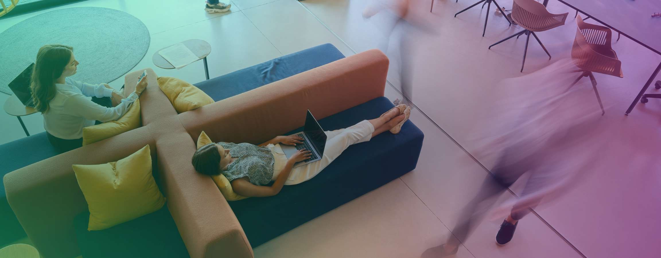 Person on a laptop in a shared office space