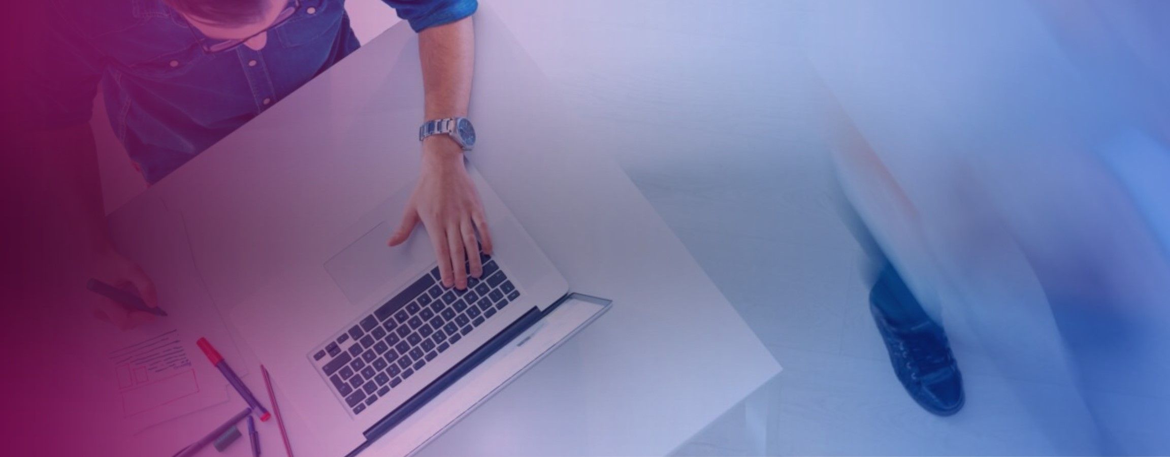 A birds eye view of a person working on their laptop