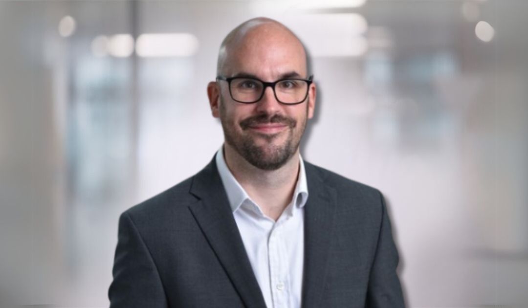 headshot of neil carroll