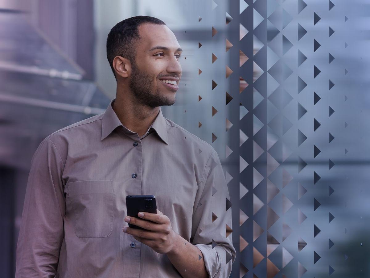Man with mobile reading Azets Barometer