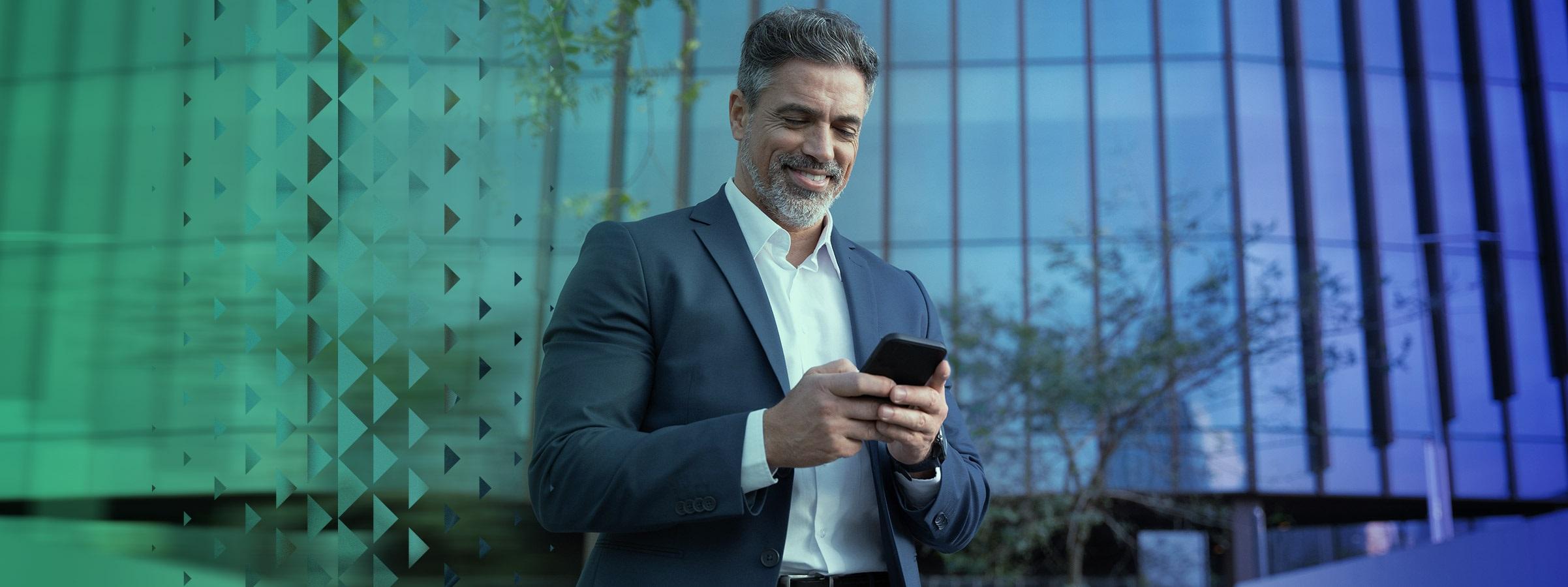 Man smiling and watching the phone
