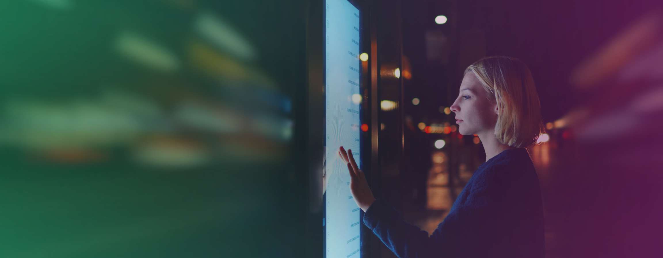 Woman looking at a touchscreen