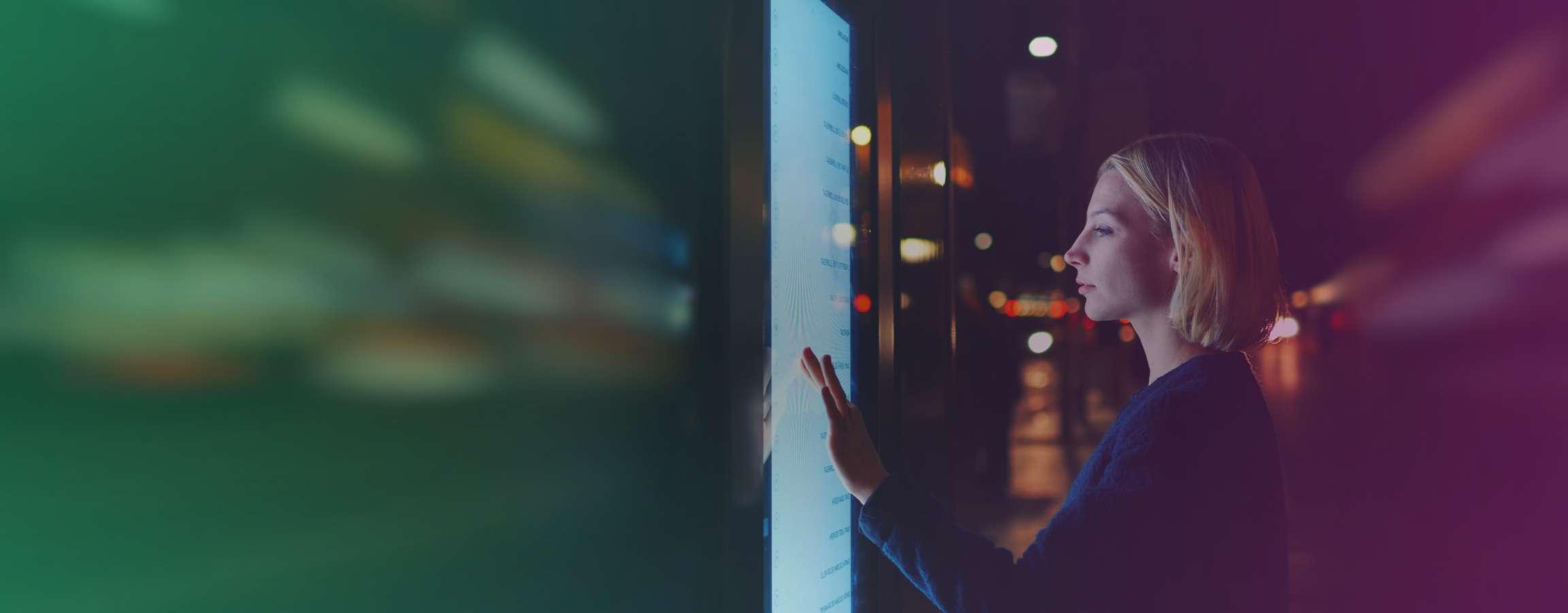 Woman looking at a touchscreen