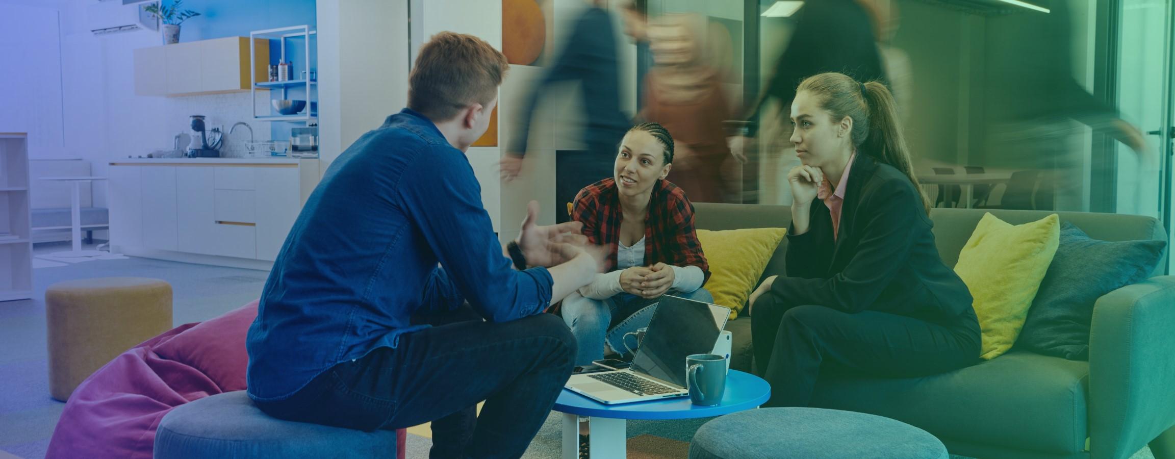 Office stock image, people conversing at a table