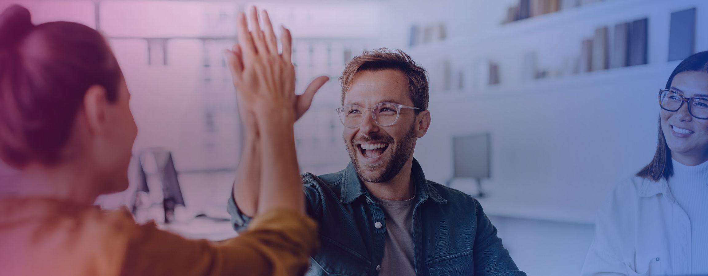 Business colleagues high fiving