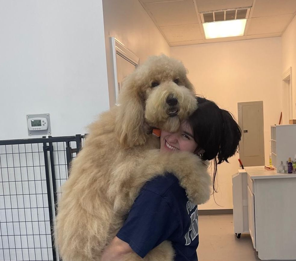 Mariana hugging a dog