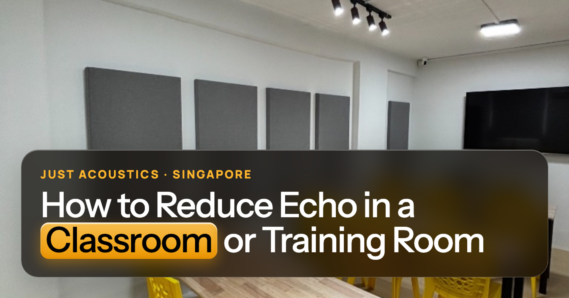 Classroom with yellow chairs and grey acoustic panels on the walls