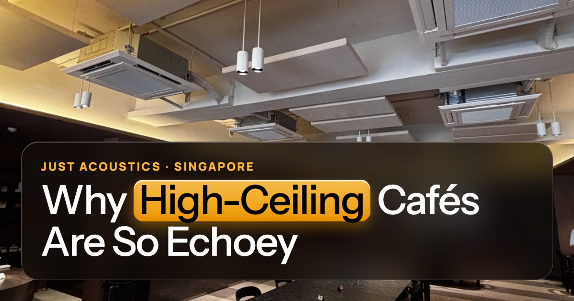 High-ceiling café with suspended acoustic clouds
