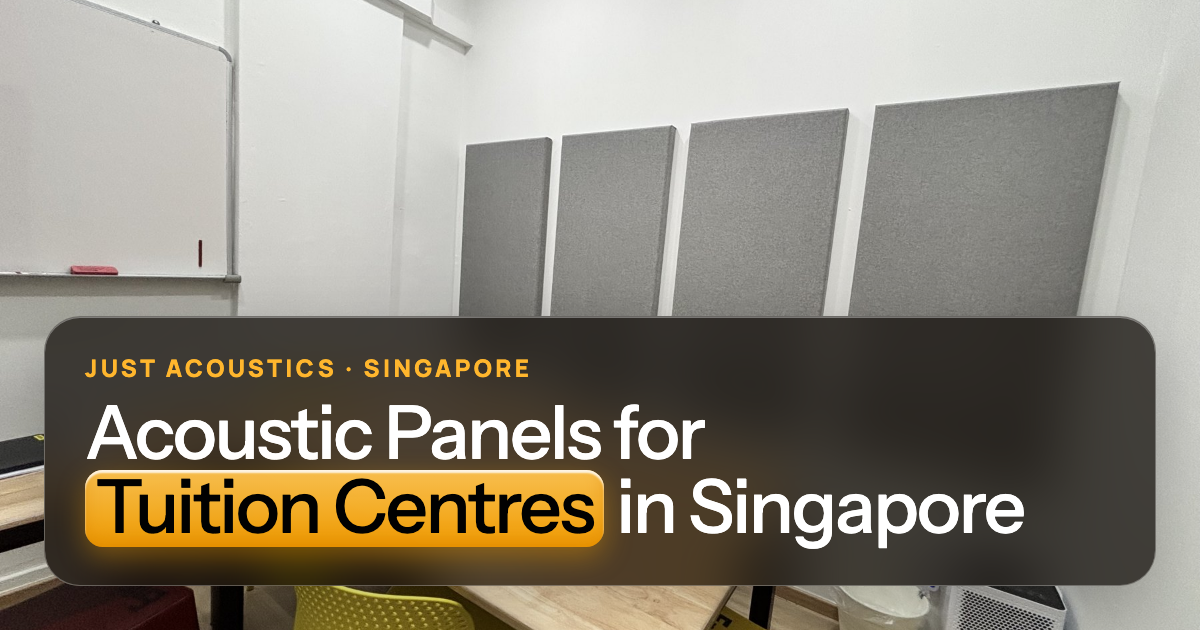 Tuition classroom with grey acoustic panels and a long table