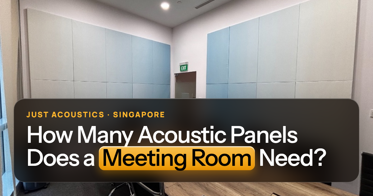 Meeting room with acoustic panels on the walls and a wooden table