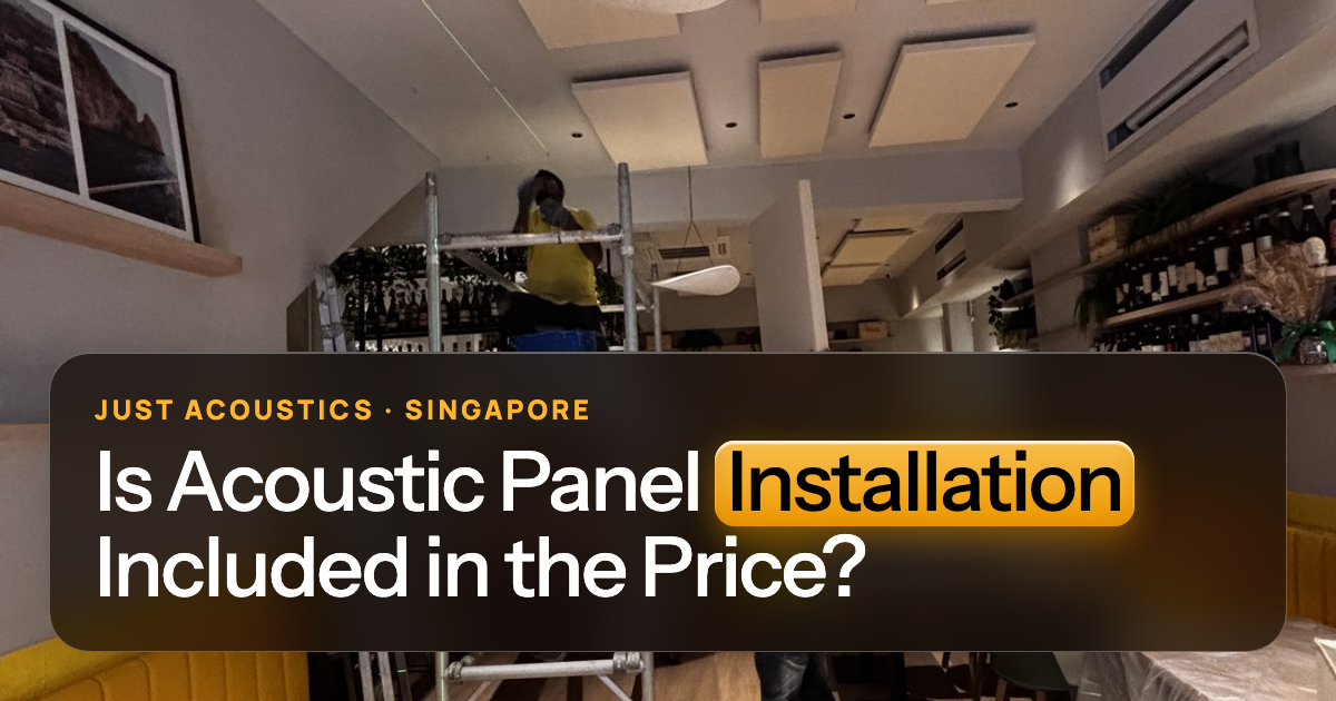 Installer mounting an acoustic panel on a restaurant wall
