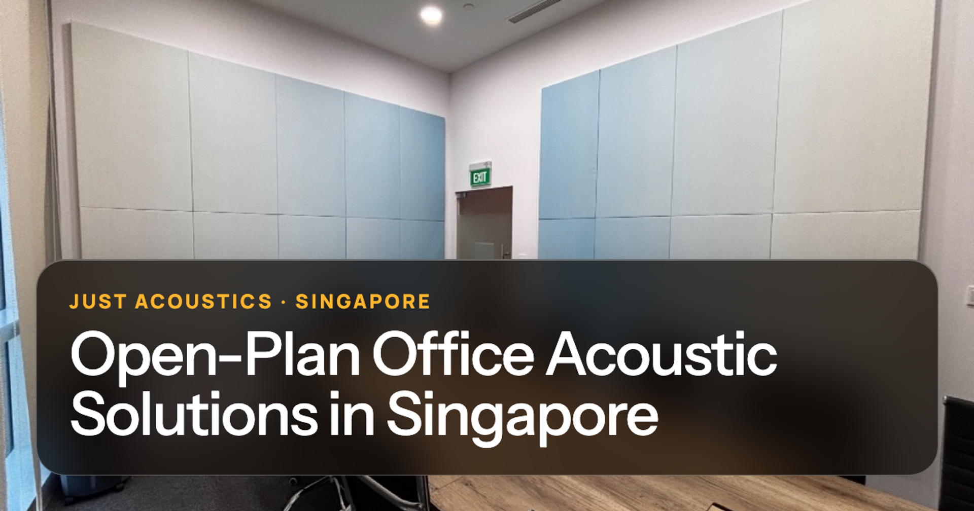 Open-plan office meeting room with acoustic panels