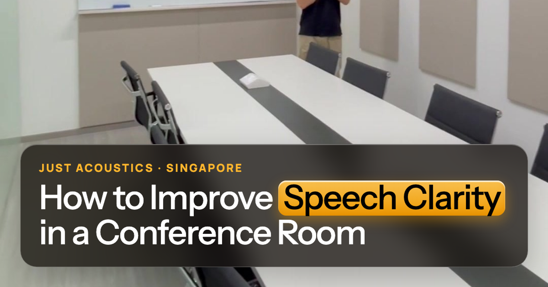 Conference room with acoustic panels and a long white table