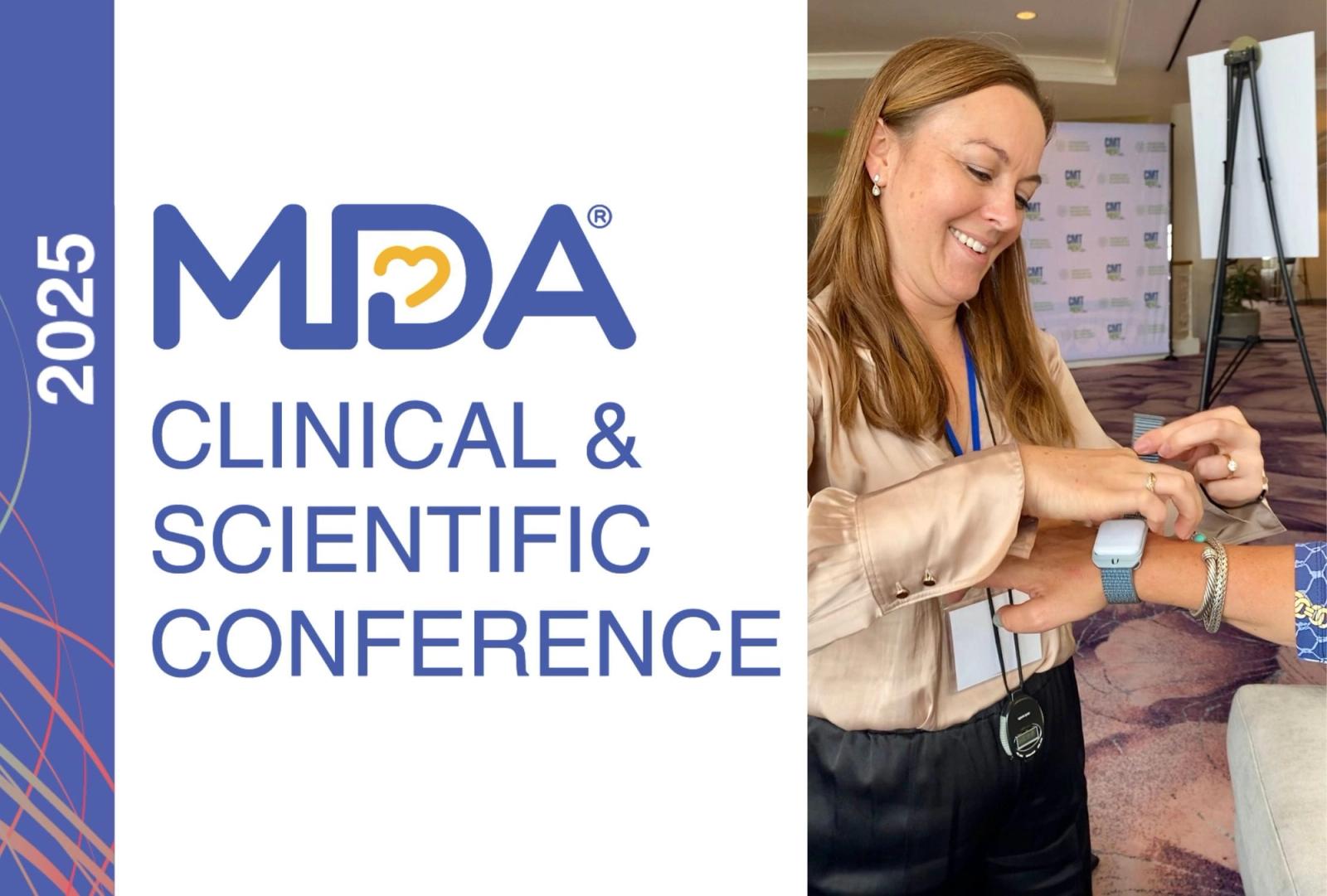Woman wearing conference badge demonstrates wearable device at 2025 MDA Clinical & Scientific Conference.