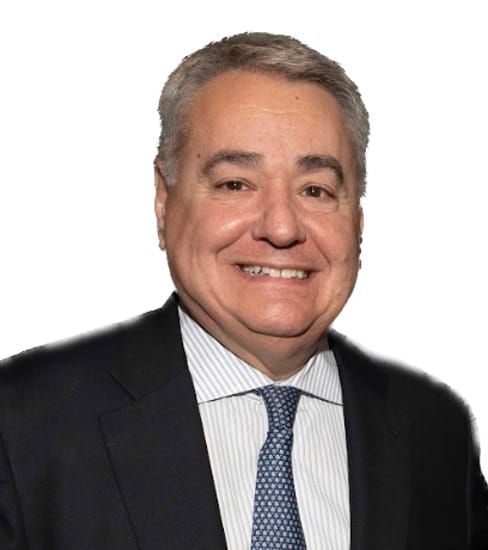 Professional headshot of middle-aged man in dark suit, light striped shirt, and blue tie against white background.