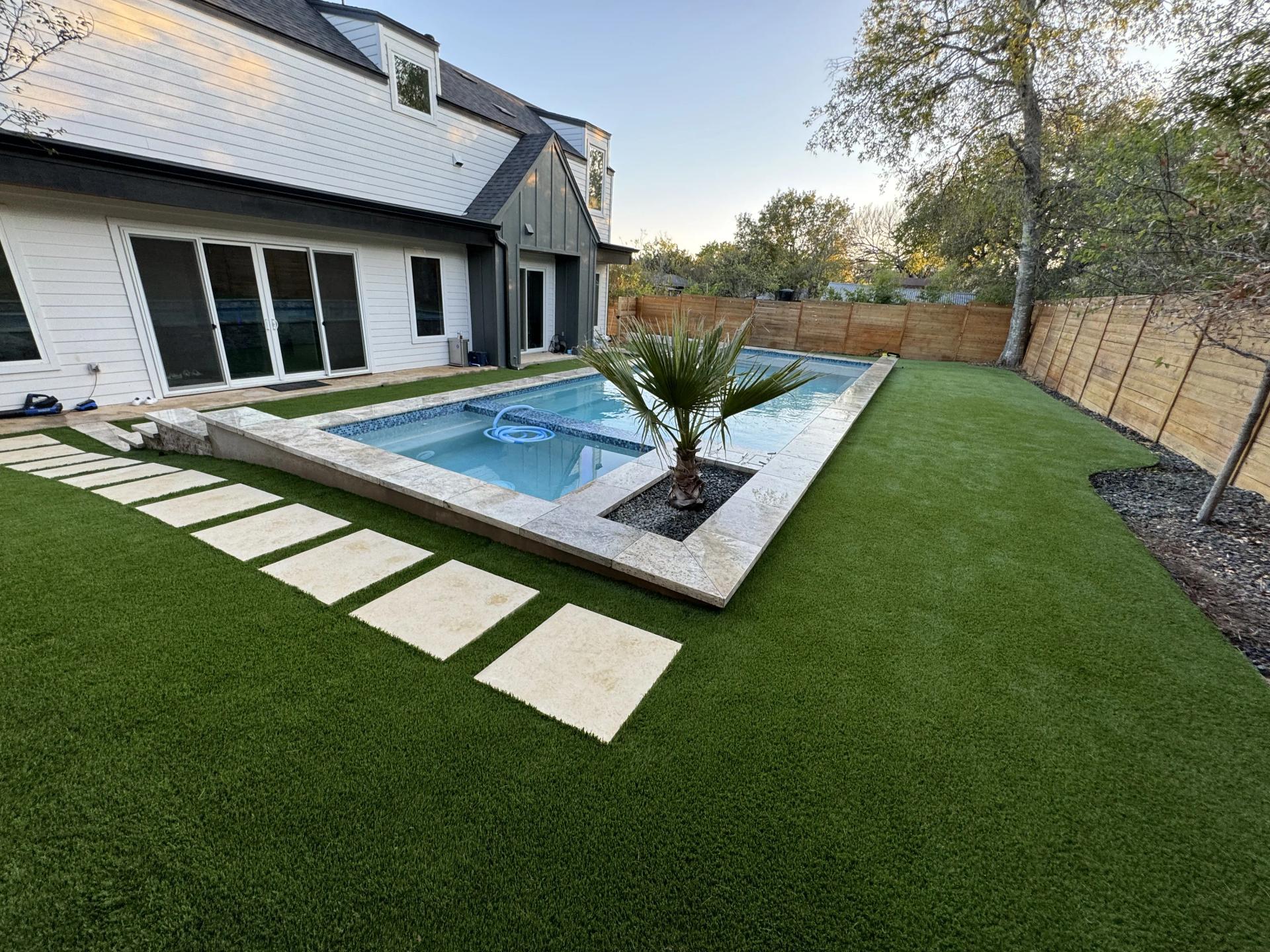 Artificial turf in a modern backyard setting