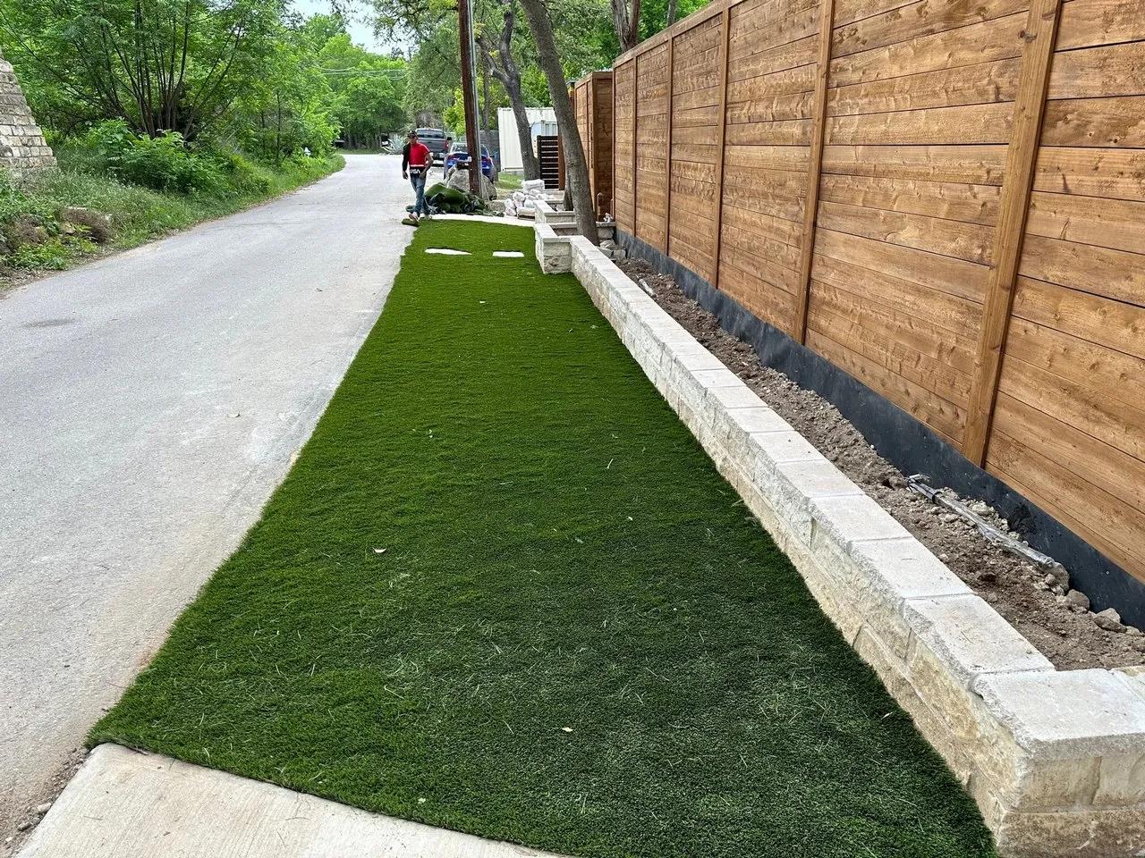 Artificial section in front of a fence near the road