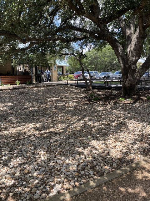 Kerbey Lane Cafe front patio before turf — bare gravel and dirt