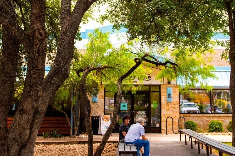 Kerbey Lane Cafe Southwest entrance and shaded patio beneath its signature live oak in Austin