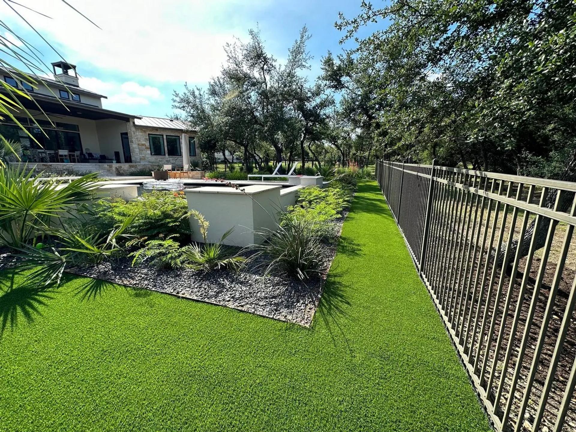 Backyard with artificial turf and a pool