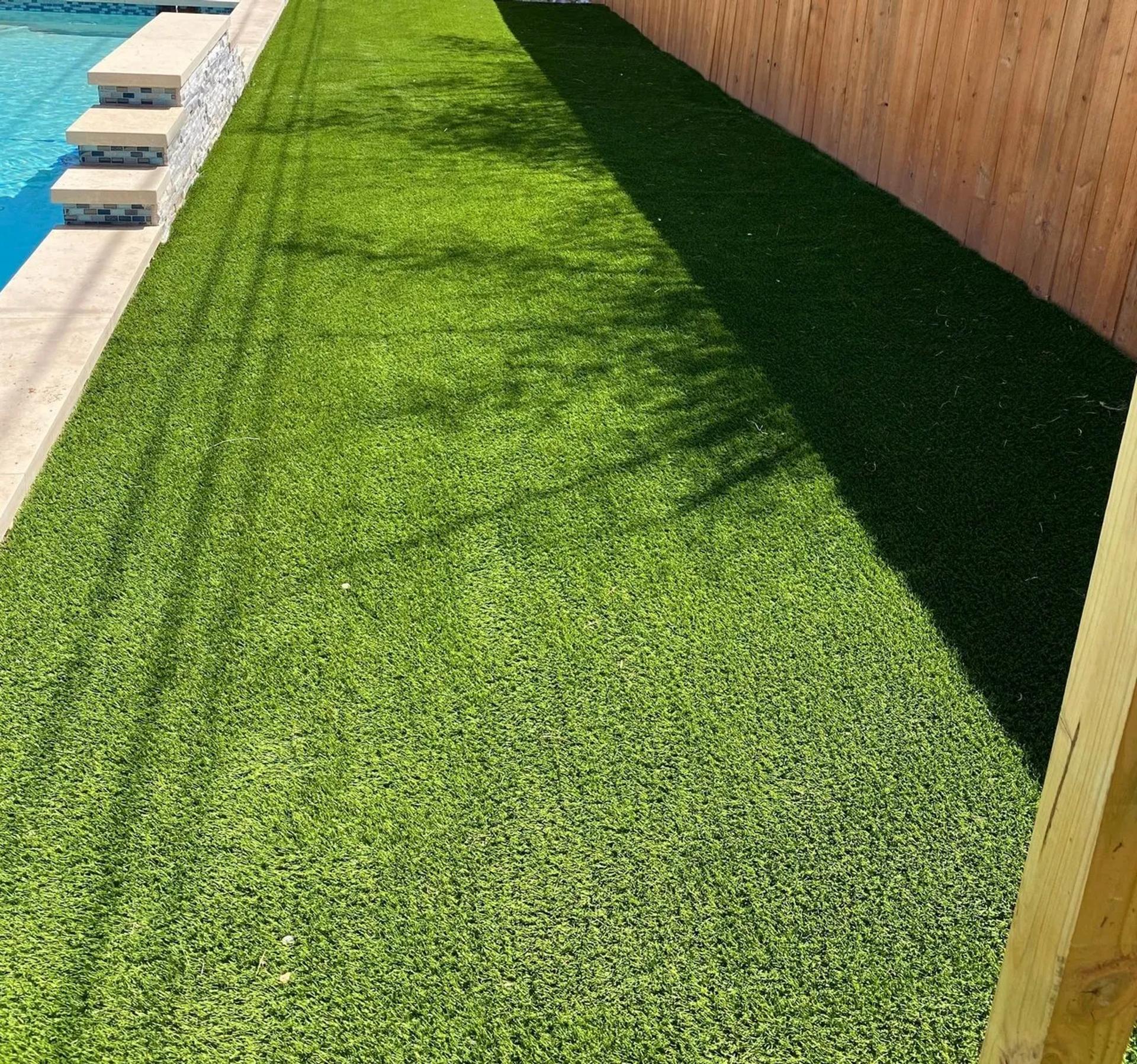 Pool next to artificial turf area