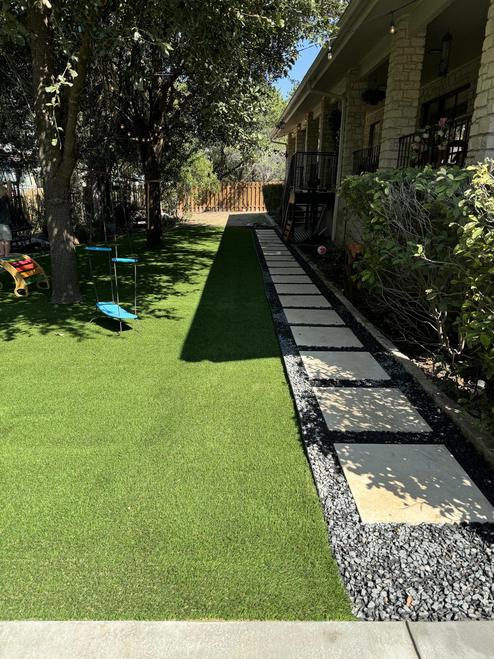 Artificial turf installation in backyard